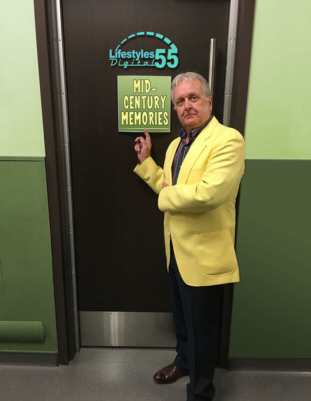 Jim Ingebrigtsen wearing a coat and standing near a door