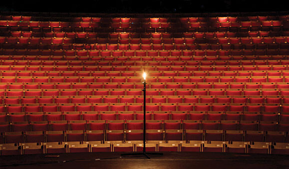 Ghost light illuminates an empty theatre