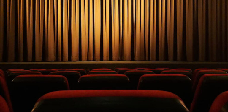Ghost light illuminates an empty theatre