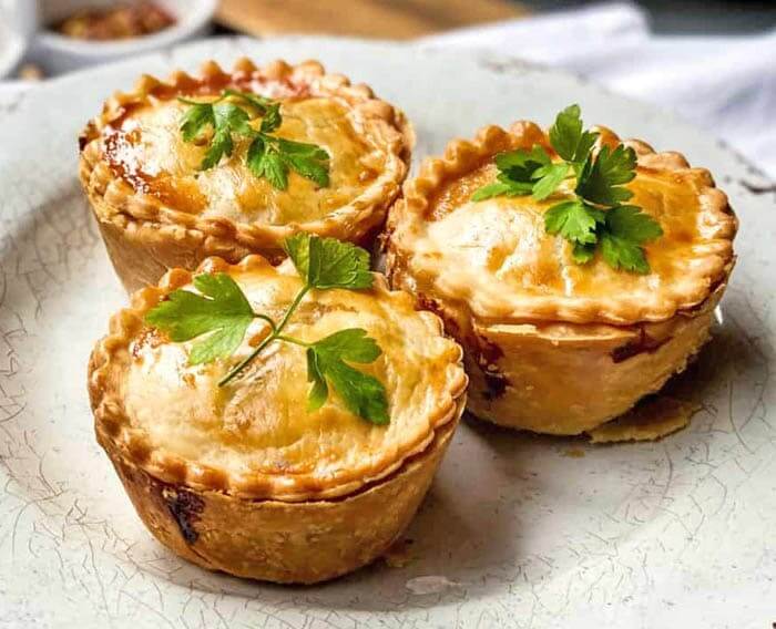 Little savory beef hand pies with flaky golden crust